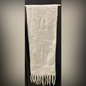 Soft, cozy light wool off white scarf. Size without the fringe is 14 x 70 inches